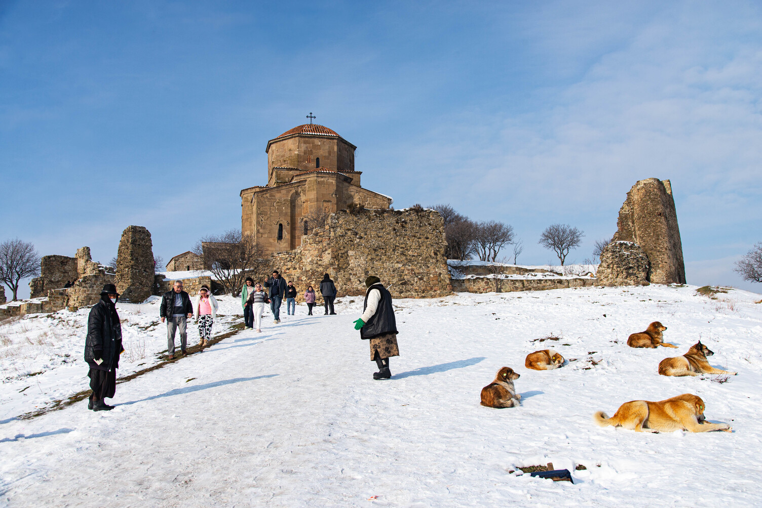 Mtskheta, Georgia-January 14, 2023: Tourists visit Jvari Monastery is one of the most famous place in Georgia stands on the mountain top at the confluence of the Mtkvari and Aragvi rivers.
